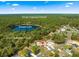 Breathtaking aerial view of a home nestled near a lake within Ocala National Forest at 1192 Ne 130Th Ter, Silver Springs, FL 34488