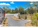 A gravel path leads to the backyard with privacy fence, creating a serene outdoor living space at 1192 Ne 130Th Ter, Silver Springs, FL 34488