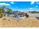 Landscaped backyard includes a rock garden area, gravel pathways, privacy fence and a screened-in lanai at 1192 Ne 130Th Ter, Silver Springs, FL 34488