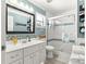 Well-lit bathroom with a glass-enclosed shower and mosaic tile accents at 1192 Ne 130Th Ter, Silver Springs, FL 34488