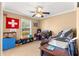 Bedroom featuring a ceiling fan and ample natural light from the window at 1192 Ne 130Th Ter, Silver Springs, FL 34488