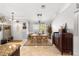 Dining area with tile flooring, modern lighting, and seamless flow to adjacent rooms at 1192 Ne 130Th Ter, Silver Springs, FL 34488