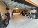 Spacious garage providing ample storage and workshop area, complete with tools and equipment at 1192 Ne 130Th Ter, Silver Springs, FL 34488