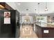 Well-equipped kitchen featuring modern appliances, tile flooring, and a center island at 1192 Ne 130Th Ter, Silver Springs, FL 34488