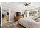 Spacious main bedroom with a pool view and open doorway leading to the living area at 1192 Ne 130Th Ter, Silver Springs, FL 34488