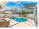 Enjoy the backyard pool and lanai area, perfect for relaxing and entertaining with Gathering and friends at 1192 Ne 130Th Ter, Silver Springs, FL 34488