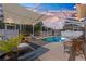 Relaxing screened-in pool area featuring ample seating, shade, and lush greenery, perfect for outdoor enjoyment at 1192 Ne 130Th Ter, Silver Springs, FL 34488