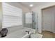 This bathroom features a soaking tub, a glass-enclosed shower, and a decorative vase at 12139 Se 91St Ter, Summerfield, FL 34491
