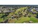 Scenic aerial view of a well-manicured golf course winding through a residential community at 12139 Se 91St Ter, Summerfield, FL 34491