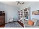 Cozy office space with built-in bookshelves and a comfortable reading chair at 12139 Se 91St Ter, Summerfield, FL 34491