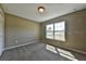 Carpeted bedroom includes a window to let in natural light and a closet for storage at 14230 Se 34Th Ct, Summerfield, FL 34491