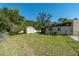 Spacious backyard with a storage shed, offering ample space for outdoor activities and relaxation at 1505 Ne 33Rd Pl, Ocala, FL 34479