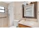 Well-lit bathroom featuring a shower, modern vanity, and accessible features at 1505 Ne 33Rd Pl, Ocala, FL 34479