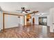 The open-concept living area features hardwood floors and seamlessly connects to the updated kitchen and glass sliding doors at 1505 Ne 33Rd Pl, Ocala, FL 34479