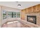 Living room features wood floors, brick fireplace, and a bay window at 1505 Ne 33Rd Pl, Ocala, FL 34479