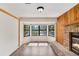 Living room features wood floors, brick fireplace, and a bay window at 1505 Ne 33Rd Pl, Ocala, FL 34479