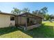 Enclosed screened porch offering a relaxing space with outdoor views and added protection from the elements at 1505 Ne 33Rd Pl, Ocala, FL 34479