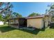 Cozy screened porch attached to a home, perfect for enjoying the outdoors in comfort at 1505 Ne 33Rd Pl, Ocala, FL 34479