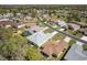 A neighborhood aerial view of attractive homes with green lawns, mature trees, and well-maintained streets at 15304 Sw 15Th Terrace Rd, Ocala, FL 34473