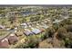 Aerial view of the neighborhood with lush green landscaping and a nearby pond at 15304 Sw 15Th Terrace Rd, Ocala, FL 34473