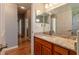 Bathroom vanity featuring a granite countertop, and a view into the shower at 15304 Sw 15Th Terrace Rd, Ocala, FL 34473