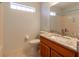 Bathroom features a granite vanity top, wood cabinets, and recessed lighting at 15304 Sw 15Th Terrace Rd, Ocala, FL 34473