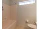 This bathroom features a bathtub and shower combination at 15304 Sw 15Th Terrace Rd, Ocala, FL 34473