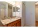Bathroom with granite vanity top, undermount sink, and updated faucet and lighting at 15304 Sw 15Th Terrace Rd, Ocala, FL 34473