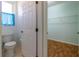 View of toilet and walk-in closet with wire shelving in bathroom at 15304 Sw 15Th Terrace Rd, Ocala, FL 34473