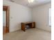 Bedroom with carpet, ceiling fan, desk, and a window with blinds at 15304 Sw 15Th Terrace Rd, Ocala, FL 34473