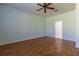 This bedroom features hardwood floors, natural light, and an ensuite bathroom at 15304 Sw 15Th Terrace Rd, Ocala, FL 34473