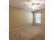 Neutral bedroom features carpet flooring, ceiling fan, and natural light from the window at 15304 Sw 15Th Terrace Rd, Ocala, FL 34473
