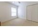 Carpeted bedroom featuring a ceiling fan and a window with blinds at 15304 Sw 15Th Terrace Rd, Ocala, FL 34473