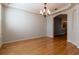 Bright dining room features beautiful hardwood floors and a modern chandelier at 15304 Sw 15Th Terrace Rd, Ocala, FL 34473