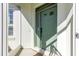 Welcoming front door with glass accents, a smart lock, and sidelight, creating an inviting entrance at 15304 Sw 15Th Terrace Rd, Ocala, FL 34473