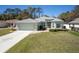 Charming single-story home with a well-manicured lawn, lovely landscaping, and a spacious two-car garage at 15304 Sw 15Th Terrace Rd, Ocala, FL 34473