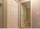 Hallway with closets and a view into one of the bedrooms at 15304 Sw 15Th Terrace Rd, Ocala, FL 34473