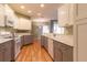 Open kitchen with gas range, modern appliances, and hardwood floors at 15304 Sw 15Th Terrace Rd, Ocala, FL 34473