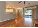 Open concept living room features hardwood floors and sliding doors to the lanai at 15304 Sw 15Th Terrace Rd, Ocala, FL 34473
