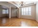 Hardwood floors lead to front door and large bright window with plantation shutters at 15304 Sw 15Th Terrace Rd, Ocala, FL 34473