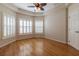 Bright living room with hardwood floors, trey ceiling, and plantation shutters offering ample sunlight at 15304 Sw 15Th Terrace Rd, Ocala, FL 34473