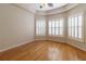 Spacious room with hardwood floors, trey ceiling, and plantation shutters allowing for natural light at 15304 Sw 15Th Terrace Rd, Ocala, FL 34473