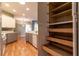 Walk-in pantry with multiple shelves offers ample kitchen storage at 15304 Sw 15Th Terrace Rd, Ocala, FL 34473