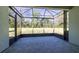 Screened patio featuring views of the backyard and an outdoor garden at 15304 Sw 15Th Terrace Rd, Ocala, FL 34473