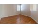 Bright room featuring hardwood floors and plantation shutters offering natural light from the window at 15304 Sw 15Th Terrace Rd, Ocala, FL 34473