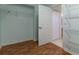 Spacious walk-in closet features wooden floors, white walls, and wire shelves at 15304 Sw 15Th Terrace Rd, Ocala, FL 34473