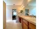 Bathroom with double sinks and vanity, tile flooring at 15702 Sw 16Th Avenue Rd, Ocala, FL 34473