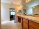 Spacious bathroom features a double sink vanity and a doorway to the bedroom at 15702 Sw 16Th Avenue Rd, Ocala, FL 34473