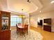 Inviting Dining Room area featuring wood table, chandelier, and hardwood floors at 15702 Sw 16Th Avenue Rd, Ocala, FL 34473