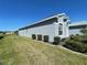 Well-maintained single-story home featuring landscaped yard and gray stucco exterior at 15702 Sw 16Th Avenue Rd, Ocala, FL 34473